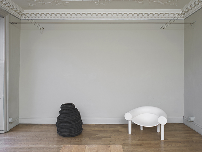 Alex Rich 'Scenario (bibendum revisited)' white Sam Son chair by Konstantin Grcic, with many thanks to Stephen Platt of Pira, stack of tyres, photography by Andy Keate