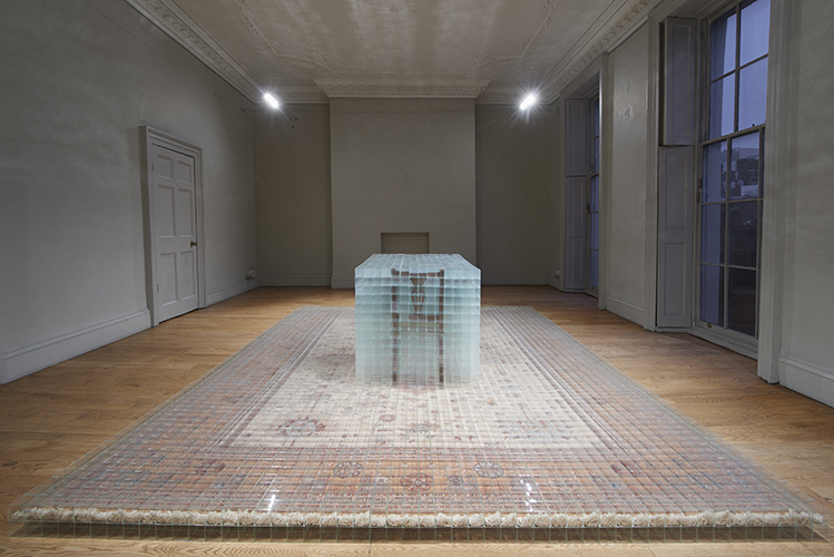 image: David Cheeseman 'Once ever After: Thrice Removed' 383×290×81(h)cm, 2014, glass, tape, carpet and furniture (7,752 glass boxes, each 58mm cubed) installation photography by Andy Keate