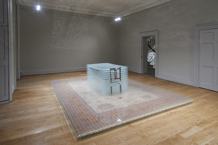 image: David Cheeseman 'Once ever After: Thrice Removed' 383×290×81(h)cm, 2014, glass, tape, carpet and furniture (7,752 glass boxes, each 58mm cubed) installation photography by Andy Keate