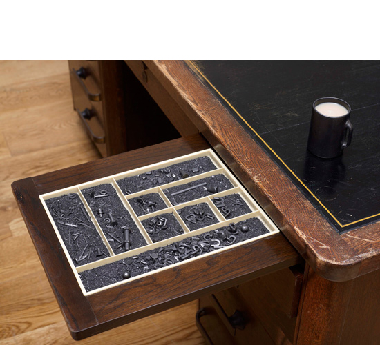 Mhairi Vari 'Parched' carved graphite, desk, tea, 2010, photo by Andy Keate