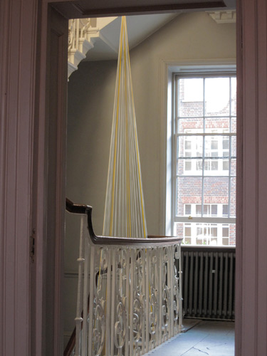 Ron Haselden 'Monument' site–specific installation, approx 6m diameter x 14m high, paper clips, yellow, white, off–white fisherman's twine, 2009